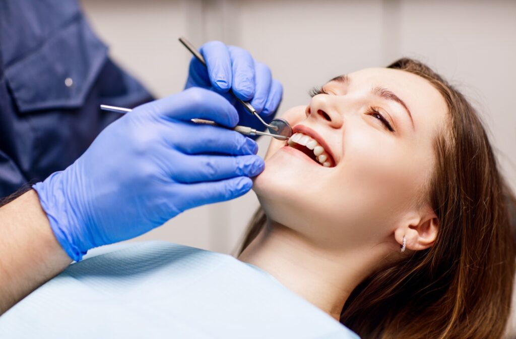 A person getting their teeth examined during a routine teeth cleaning